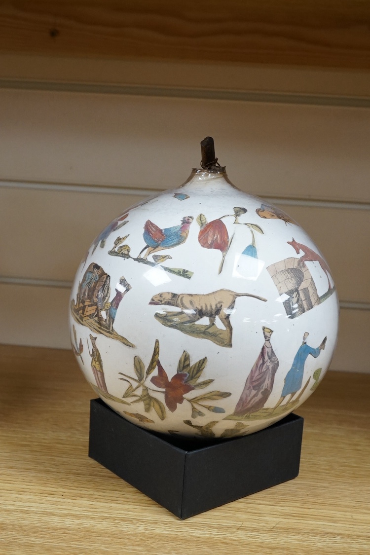 An inside decorated glass witch’s ball, 17cm in diameter. Condition - fair